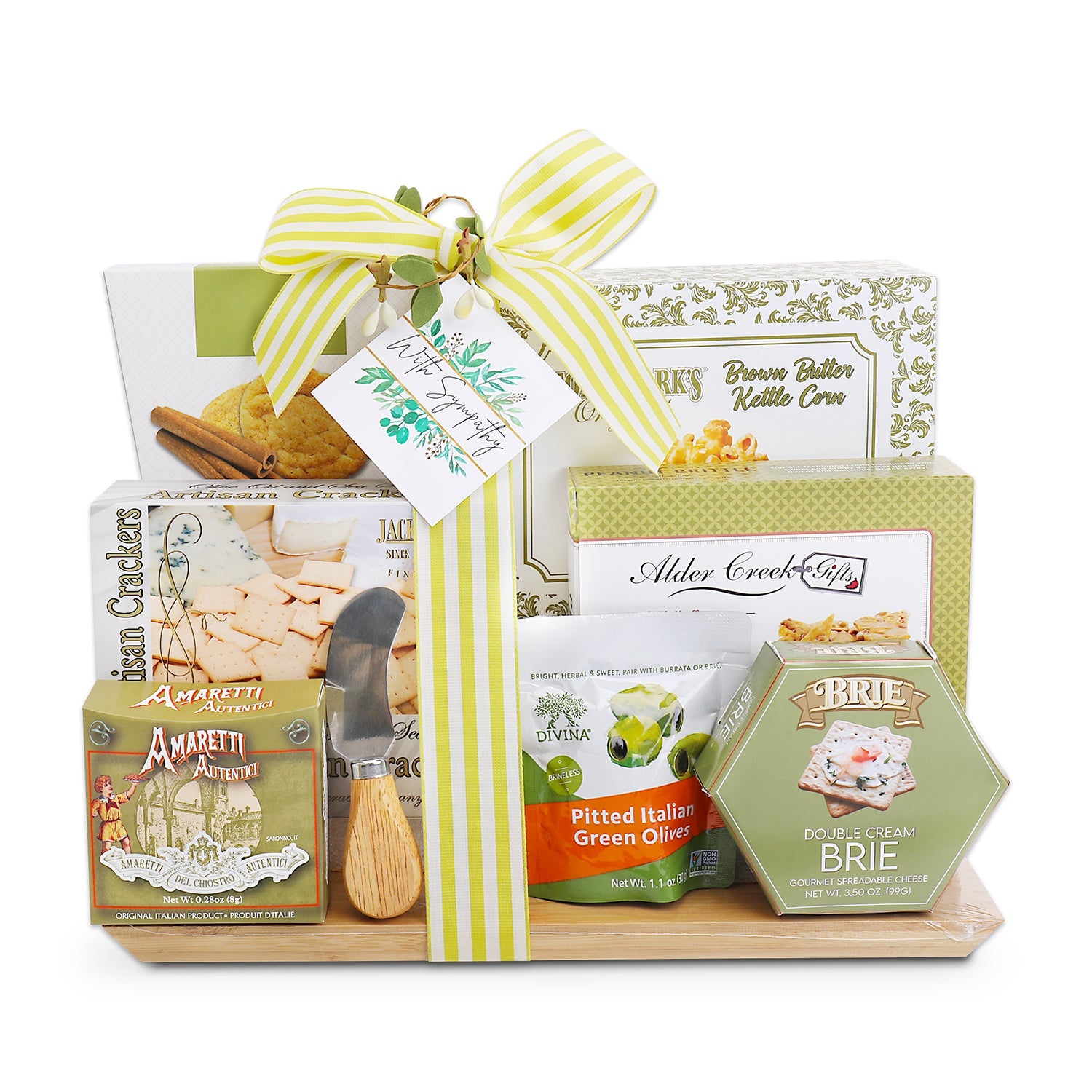 Gift basket with assorted snacks and a cheese knife on a white background
