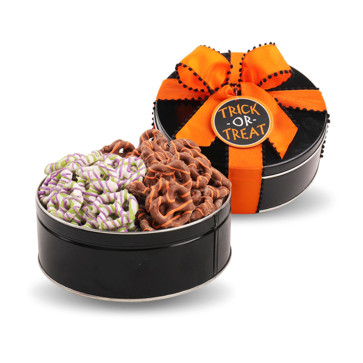 A round black gift tin filled with assorted Halloween treats, shown open with the lid behind it. The lid is wrapped in an orange ribbon with label reading “TRICK OR TREAT.