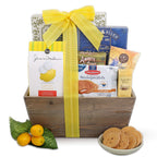 Gift basket with snacks and a yellow ribbon on a white background
