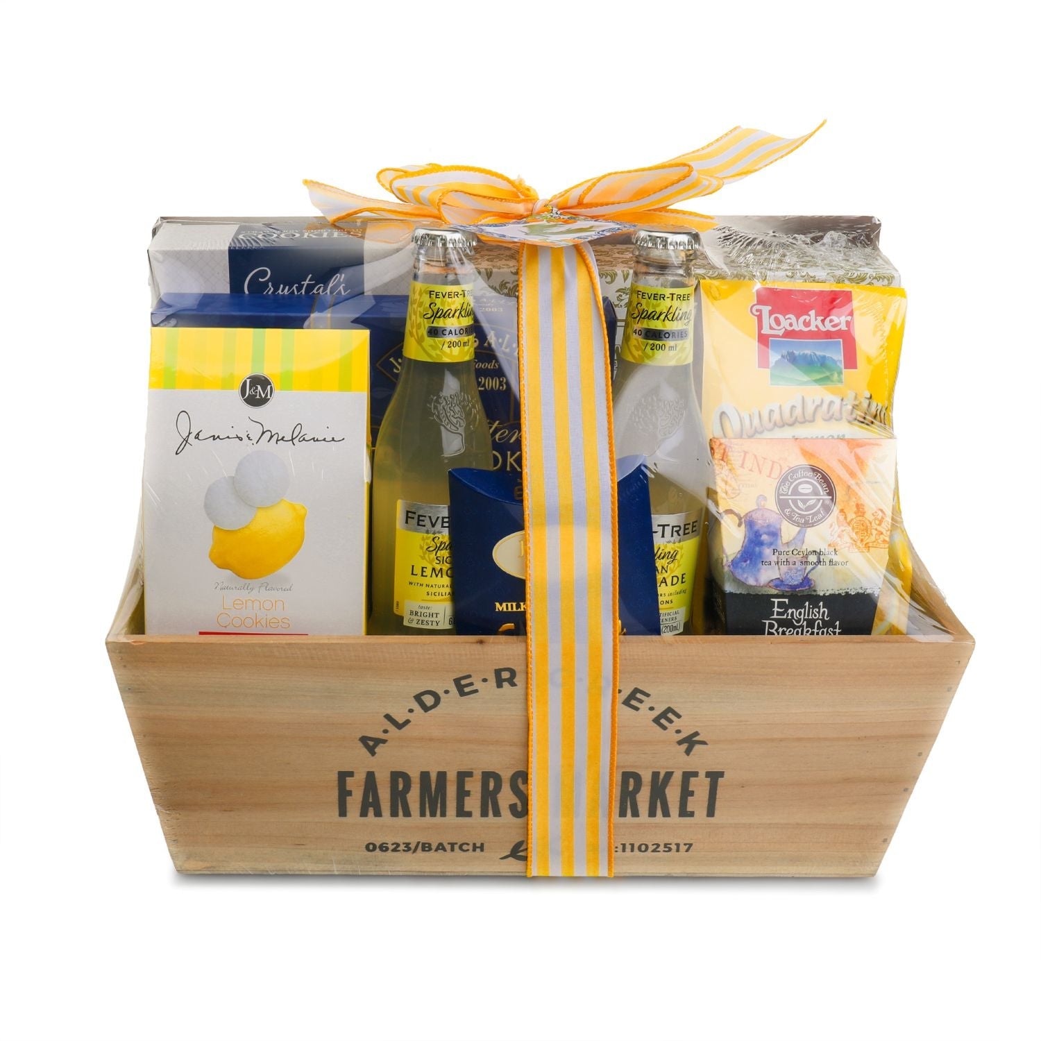 Gift basket with  Farmers Market branding, featuring a variety of products including a bottle of lemonade and packaged goods.