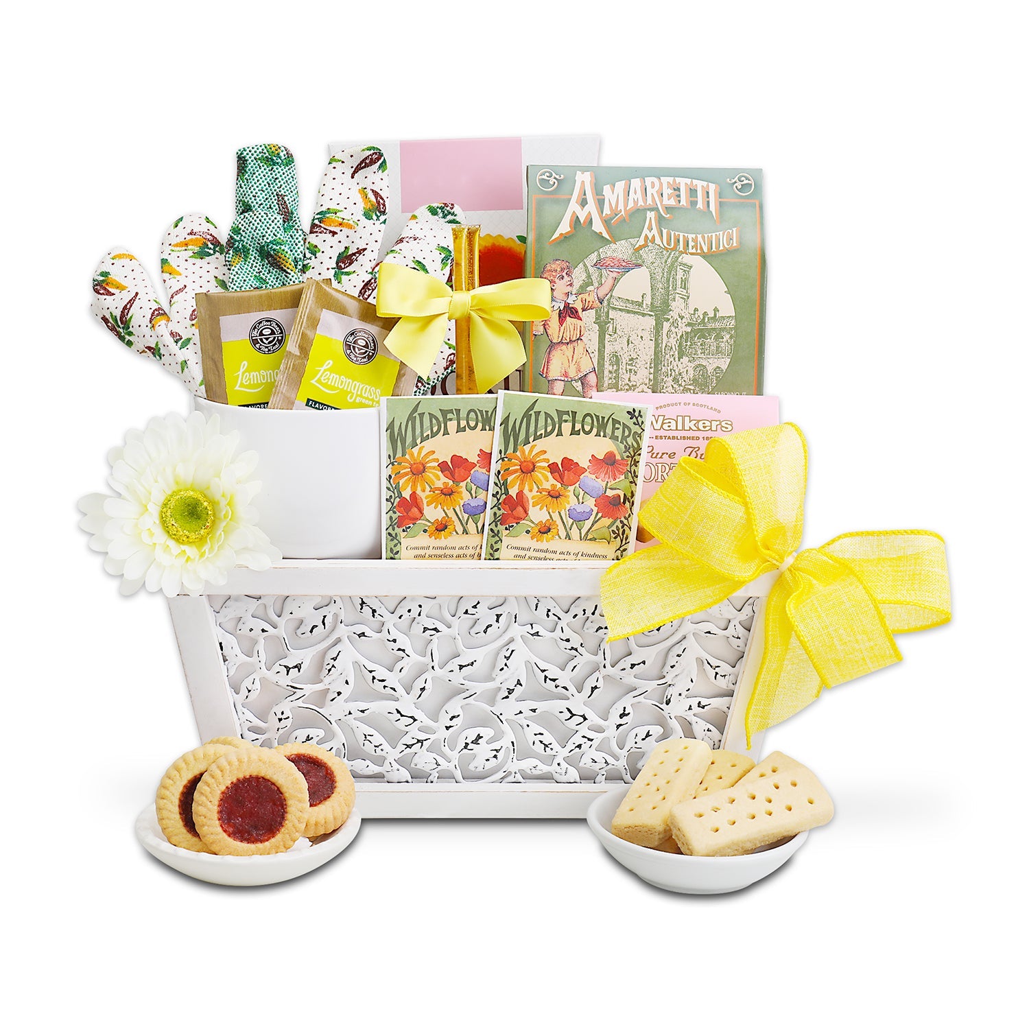 Gift basket with cookies, tea, and books on a white background